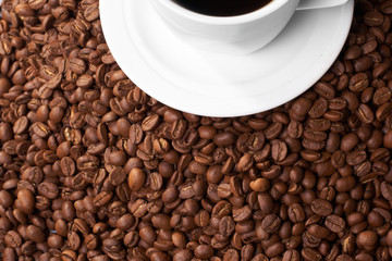 Cup with coffee, costing on coffee grain