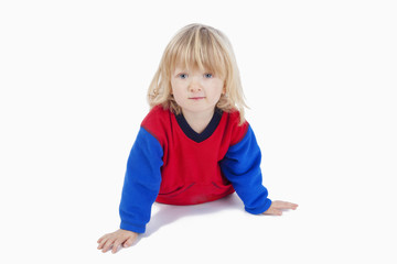 boy lying down, looking at camera