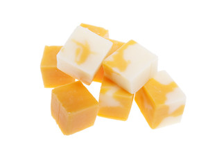 cubes of cheddar cheese isolated on white