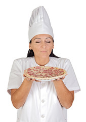 Pretty cook girl smelling delicious pizza