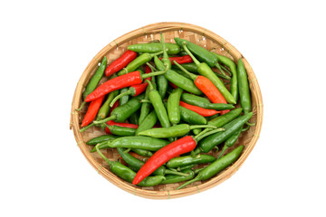 Red and green chillis in a bamboo tray