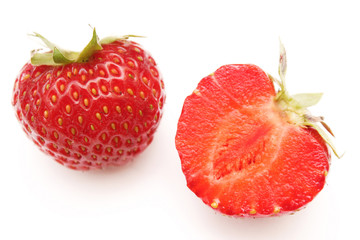 full strawberry and sliced red ripe strawberry isolated on white