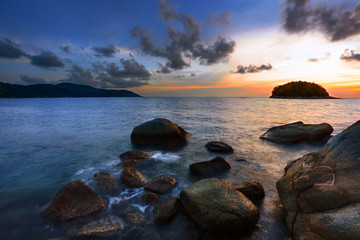 Fototapeta na wymiar Tropical sunset on the beach. Phuket island. Thailand