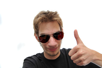 Handsome young adult with aviators holding a Thumbs up