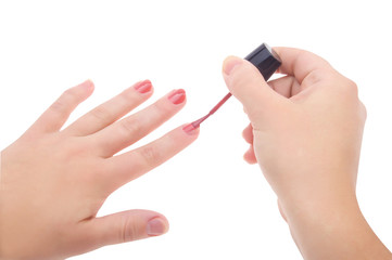 Manicure. Woman applying red nail polish isolated on white