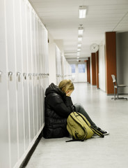 Young woman getting bullied at school