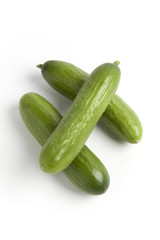 Small cucumbers on white background