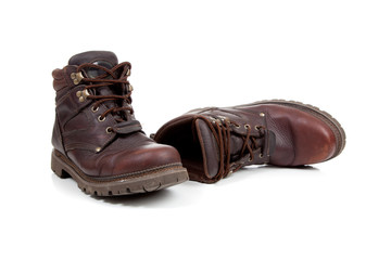 a pair of Brown leather hiking boots on white