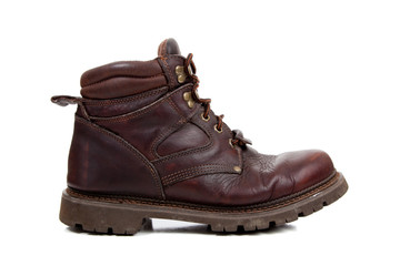 a Brown leather hiking boot on white
