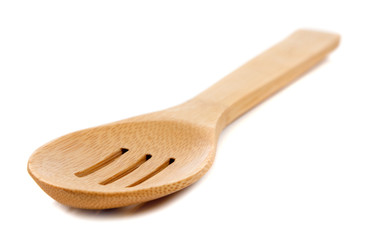 wooden kitchen spoon on white
