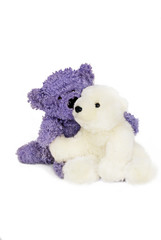 Little blue bear cuddles little white polar bear.