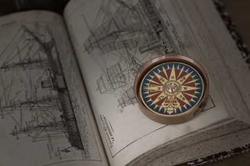 Fototapeta na wymiar Old book and compass