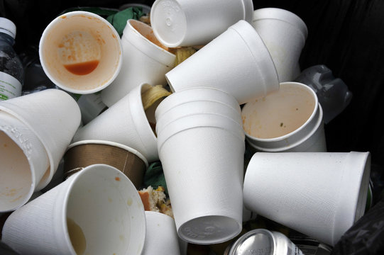 used polysdtyrene ddrinking cups in trash can