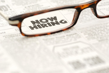 Now Hiring classified ad framed in glasses