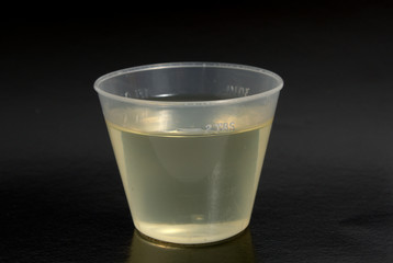 Measured glass with a medicine