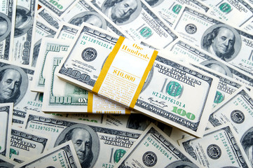 Stack of dollars on money background