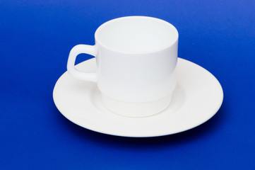 White cup isolated on the colourful background