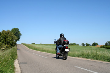 biker driving away