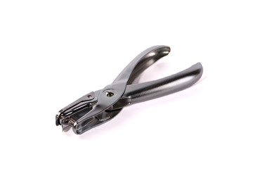 Metal single hole punch against white background