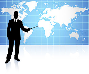 Young businessman pointing at world map