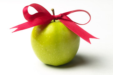 Green apple and red ribbon bow
