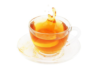 Glass cup of tea with lemon isolated on white