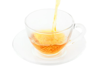 Tea pouring, glass cup of tea isolated