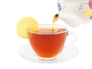 Fresh black tea pouring isolated on white
