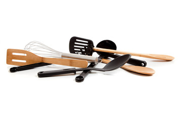 Assorted kitchen utensils on a white background