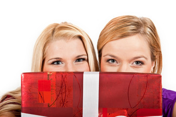 Two young party woman with christmas gift