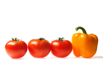 ripe tasty tomatoes and peppers on a white background