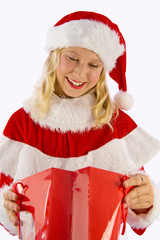 a happy Christmasgirl with a present-bag