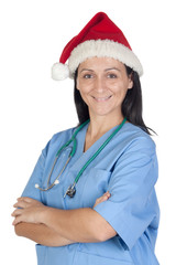 Attractive doctor woman with Christmas cup