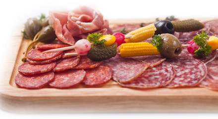 Board at restaurant with meat and sausage cutting