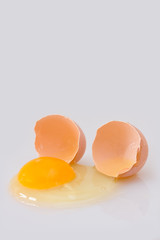 Broken egg on a white background