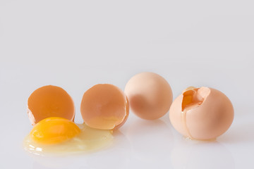 Broken eggs on a white background