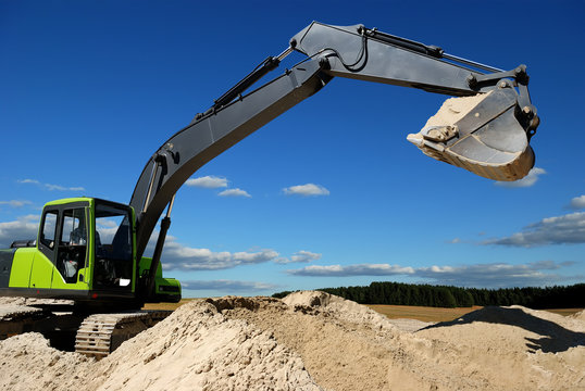 Excavator loader in sandpit