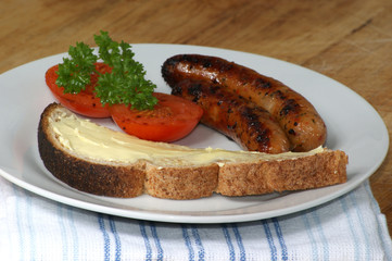 grilled organic sausage with toast and tomato