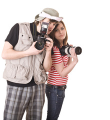 Photographer couple with digital camera.