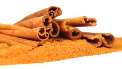 Cinnamon bark and powder isolated on white