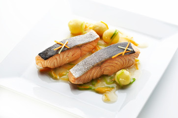 Grilled salmon steak with potato and different vegetables