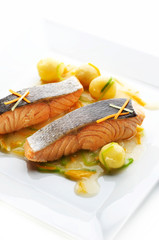Grilled salmon steak with potato and different vegetables