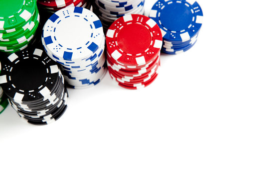 Stacks of poker chips on white with copy space