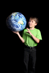 Boy  Earth in his hand looks with wonder fascination