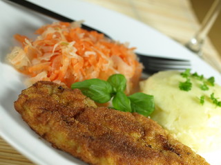 Chicken breast meal with mashed potatoes.