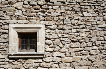 window and stone wall