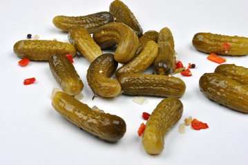 some organic sour gherkin and a white background
