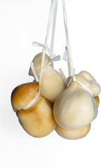 Typical handmade Italian cheese (caciocavallo) hanging by a cord