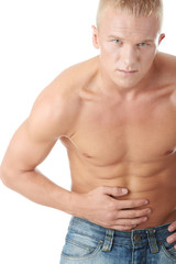 Fototapeta premium A man suffering in pain in his stomach