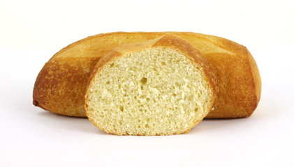 Sourdough bread loaf with single slice in the foreground